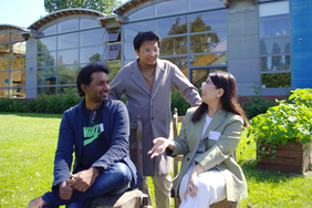 Three participants, seated and smiling outdoors, talk together after winning second place in the external category of the INSPIRED competition.